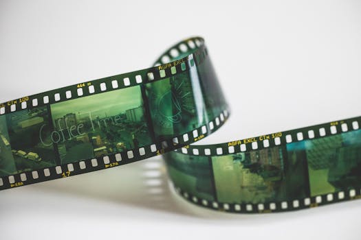 Close-up of a vintage AGFA filmstrip with cinematic exposures, evoking nostalgia.