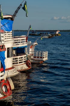 Colorful boats docked on the Amazon River in Manaus, Brasil, by a sunny day.